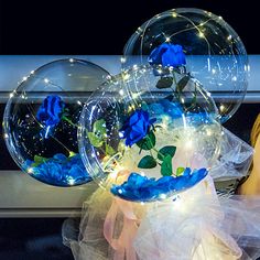 Luminous 3 Blue roses or blue orchids inside 3 transparent balloon with White and Blue Wrapping