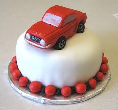1/2 Kg Chocolate Car cake with toy car on top of cake