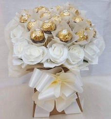 24 white roses with 16 pieces of ferrero rocher chocolates with white ribbons