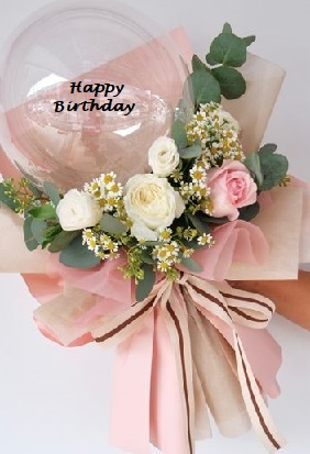 6 White and Pink Roses added with foliage on the outside of a printed happy birthday balloon bouquet with pink ribbons and pink paper