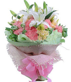 Pink carnations with white lilies in a bouquet