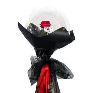 Red Rose enclosed in a Transparent Balloon with black wrapping tied with Red ribbons